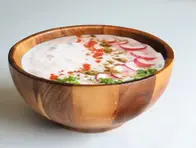 Cilantro_Radish_Raita_Cooling_Yogurt_Dish_Delicious_Accompaniment_Cilantro_Flavor_Radish_Crunchy_Bite_Spiced_Yogurt_Condiment_Refreshing_Side_Dish_Nutritious_Serving_Aromatic_Raita_Satisfying_Bite_Homemade_Ayurvedic_Dish_Radish_Cilantro_Combination_Ayurvedic_Food_Ayurveda